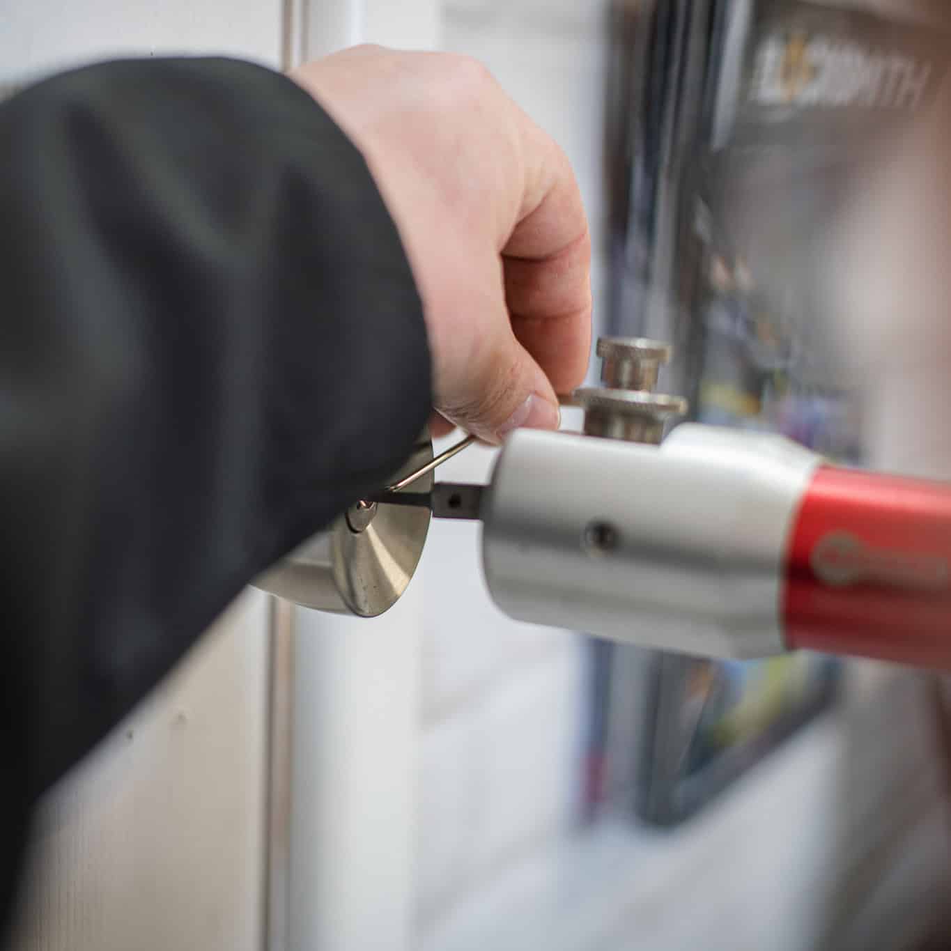 An image of a locksmith working on a lock | Emergency locksmith in Stirling